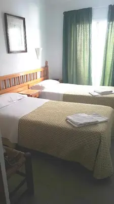 Cama o camas de una habitación en Hostal Isabel