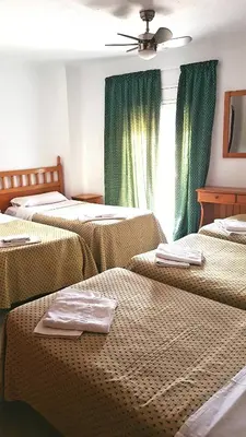 Cama o camas de una habitación en Hostal Isabel
