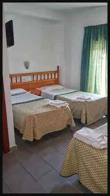 Cama o camas de una habitación en Hostal Isabel