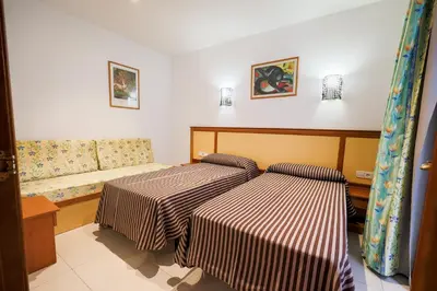 Cama o camas de una habitación en Apartamentos Royal