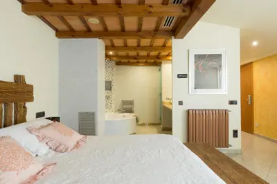 Cama o camas de una habitación en Hotel Històric