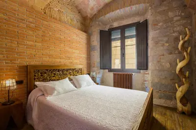 Cama o camas de una habitación en Hotel Històric