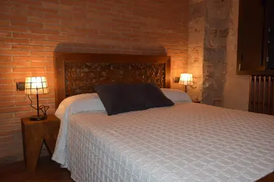 Cama o camas de una habitación en Hotel Històric