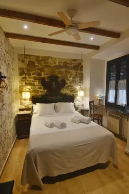 Cama o camas de una habitación en Pensió Bellmirall