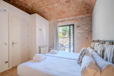 Cama o camas de una habitación en Flateli Plaça Catalunya 1-2