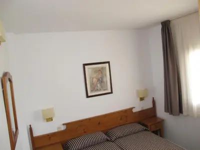 Cama o camas de una habitación en Apartamentos Santi