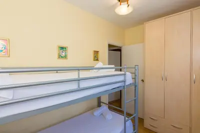 Cama o camas de una habitación en HomeHolidaysRentals Moonlight
