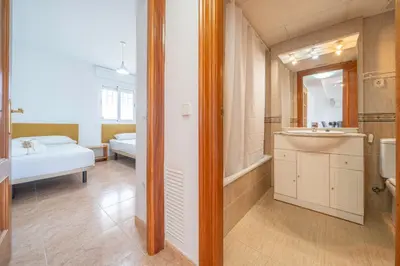 Cama o camas de una habitación en HomeHolidaysRentals Santa Susanna VIII