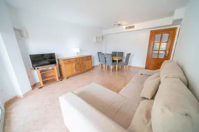 Una televisión o centro de entretenimiento en HomeHolidaysRentals Santa Susanna VIII