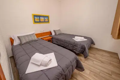 Cama o camas de una habitación en Apartamentos AR Muntanya Mar