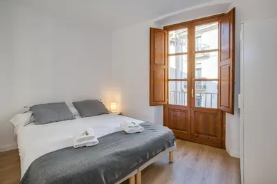 Cama o camas de una habitación en Flateli Cort Reial
