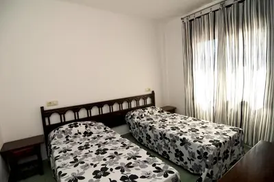 Cama o camas de una habitación en Apartamentos AR Caribe