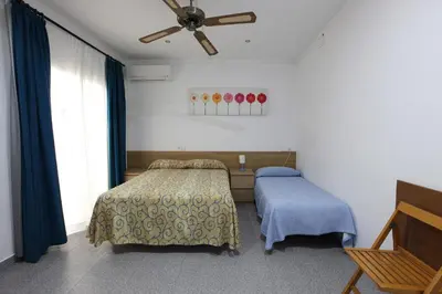 Cama o camas de una habitación en Hostal L'Alba