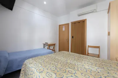 Cama o camas de una habitación en Hostal L'Alba
