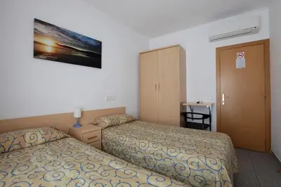Cama o camas de una habitación en Hostal L'Alba