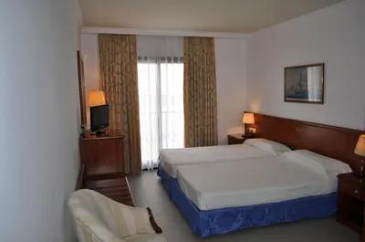 Cama o camas de una habitación en Hostal Vila del Mar