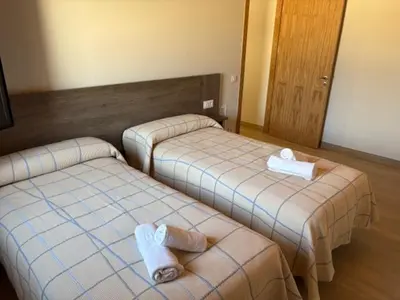 Cama o camas de una habitación en Hostal Mallorquines
