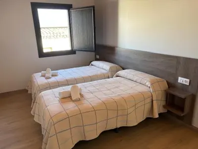 Cama o camas de una habitación en Hostal Mallorquines