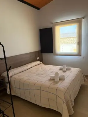 Cama o camas de una habitación en Hostal Mallorquines