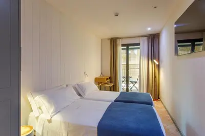 Cama o camas de una habitación en Hostal Spa Olga