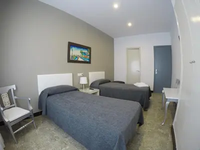 Cama o camas de una habitación en Hostal Mediterráneo