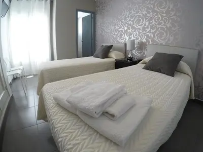 Cama o camas de una habitación en Hostal Mediterráneo