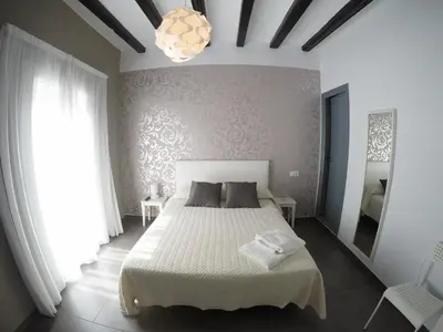 Cama o camas de una habitación en Hostal Mediterráneo