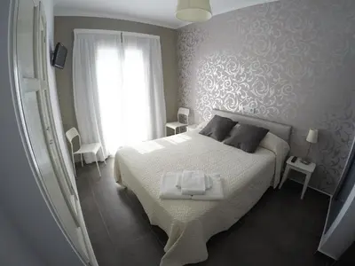 Cama o camas de una habitación en Hostal Mediterráneo