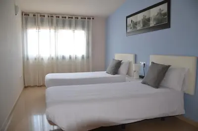 Cama o camas de una habitación en Apartamento playa Costa Barcelona
