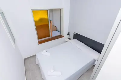 Cama o camas de una habitación en HomeHolidaysRentals Vall III