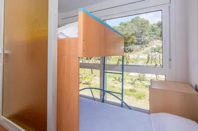 Cama o camas de una habitación en HomeHolidaysRentals Vall III
