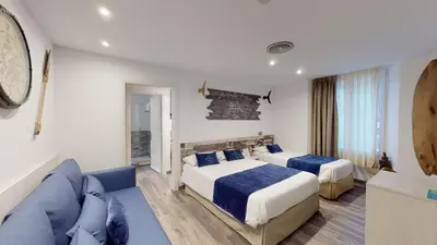 Cama o camas de una habitación en Hotel Bella Dolores