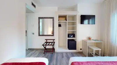 Cama o camas de una habitación en Hotel Bella Dolores