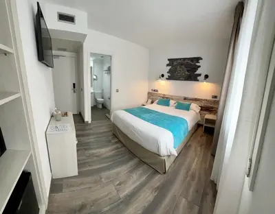 Cama o camas de una habitación en Hotel Bella Dolores