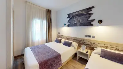 Cama o camas de una habitación en Hotel Bella Dolores