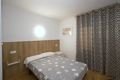 Cama o camas de una habitación en Apartamentos Zodiac
