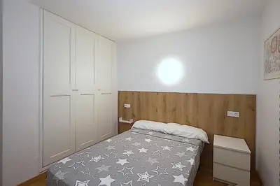 Cama o camas de una habitación en Apartamentos Zodiac