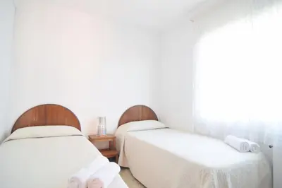 Cama o camas de una habitación en HomeHoidaysRentals Millet