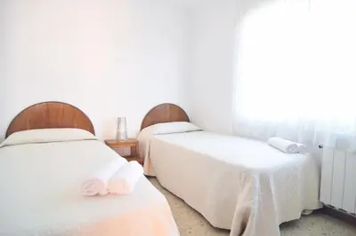 Cama o camas de una habitación en HomeHoidaysRentals Millet