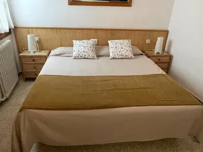 Cama o camas de una habitación en Apartamentos El Sol