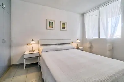 Cama o camas de una habitación en Hauzify I Apartaments Sot del Morer
