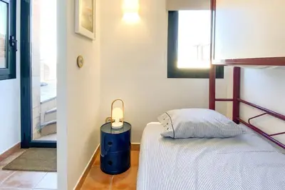 Cama o camas de una habitación en Begur Sunset 2 bedroom loft close to the center of Begur. With terrace and gorgeous sea views H42