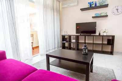 Una televisión o centro de entretenimiento en AL11 Apartamento Albert