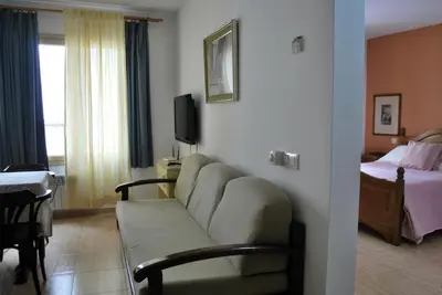 Una televisión o centro de entretenimiento en La Habana Apart Hotel