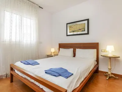 Cama o camas de una habitación en Apartment Punta Garbí by Interhome