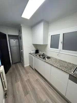 Una cocina o zona de cocina en 1ra Linea Platja de Sant Feliu