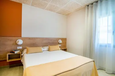 Cama o camas de una habitación en Hostal Barris