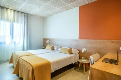 Cama o camas de una habitación en Hostal Barris
