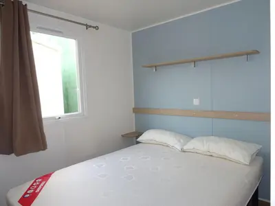Cama o camas de una habitación en Càmping Vila Village