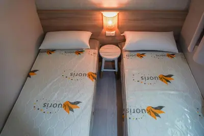 Cama o camas de una habitación en Càmping Vila Village